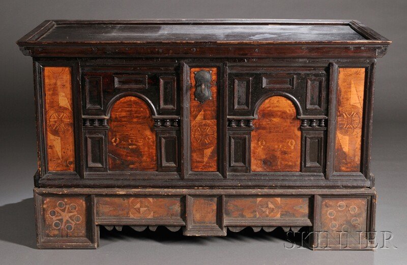 German Pine Coffer on Stand, ebonized architectura: German Pine Coffer on Stand, ebonized architectural facade to front with incised abstract motifs and symbols, with two iron handles and hinged lid opening to reveal a compartmentalized interior, on a 
