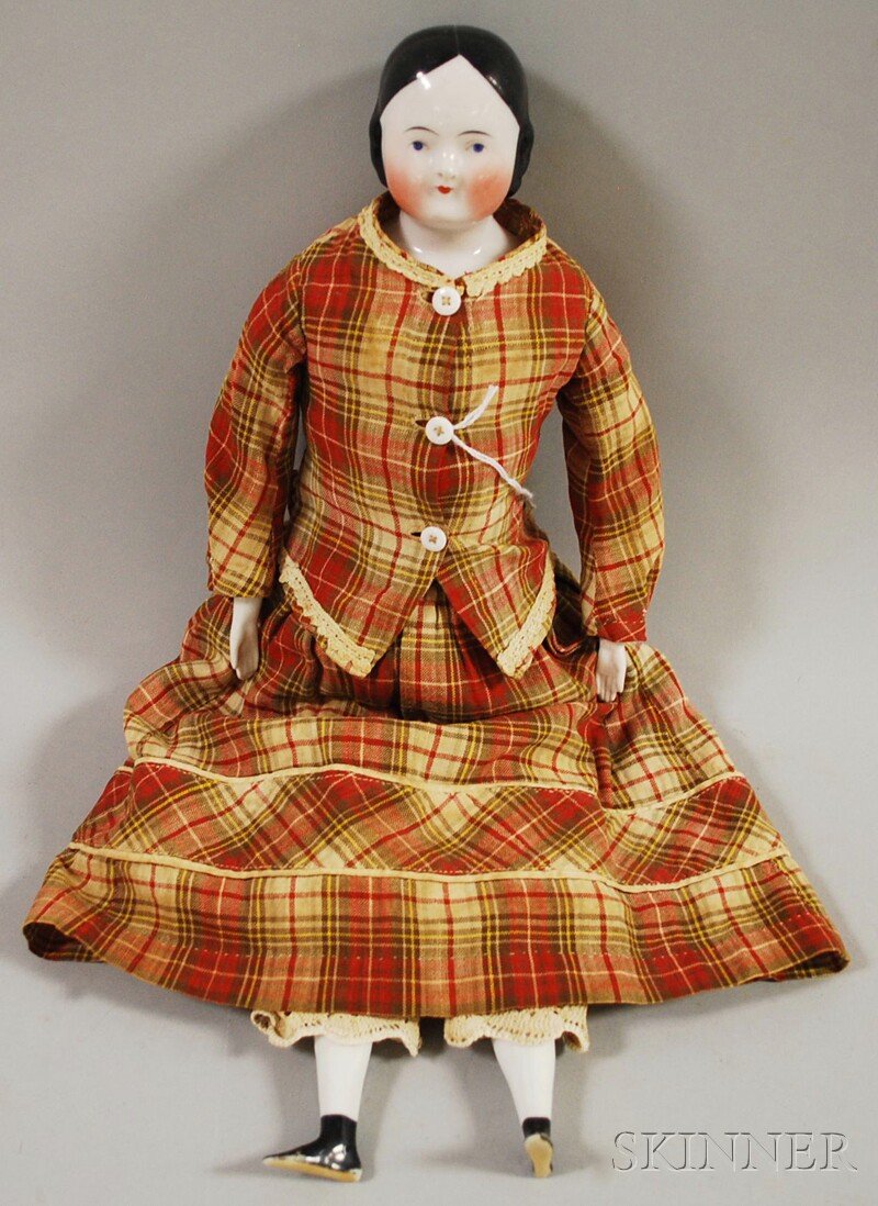 China Shoulder Head Doll, Germany, 1850s, center-pa: China Shoulder Head Doll, Germany, 1850s, center-part black hair with curls close to head, blue eyes, rosy cheeks, three sew holes, cloth body, long china arms, flat black molded shoes, red plaid dres