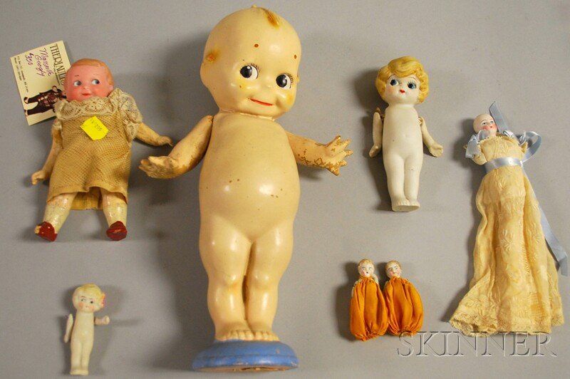 AM Googlie and Six Miscellaneous Dolls, Germany and: AM Googlie and Six Miscellaneous Dolls, Germany and Japan, bisque head AM googlie with partially legible (254?) mark, intaglio eyes to left, composition body, ht. 6 1/2; five small all-bisque dolls, a
