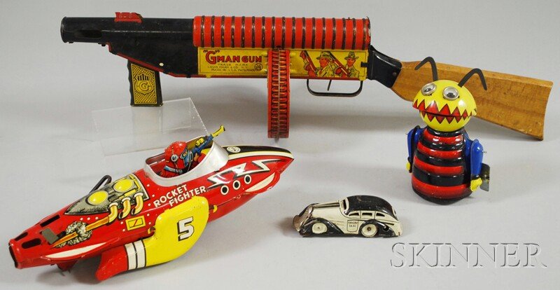 Four Marx Wind-up Tin Toys, including Tricky Taxi,: Four Marx Wind-up Tin Toys, including Tricky Taxi, alien/space creature, Rocket Fighter and "G" Man Gun, all originally wind-up, (taxi wind missing), three on wheels, some with noise-making capabiliti