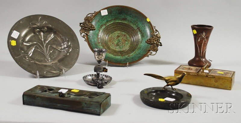 Seven Assorted Decorative Metal Desk and Table Art: Seven Assorted Decorative Metal Desk and Table Articles, a Derby Silver Co. Victorian Aesthetic silver-plated figural smoking stand, Heintz Art Metal silver overlay bronze vase, a marble tray mounted 
