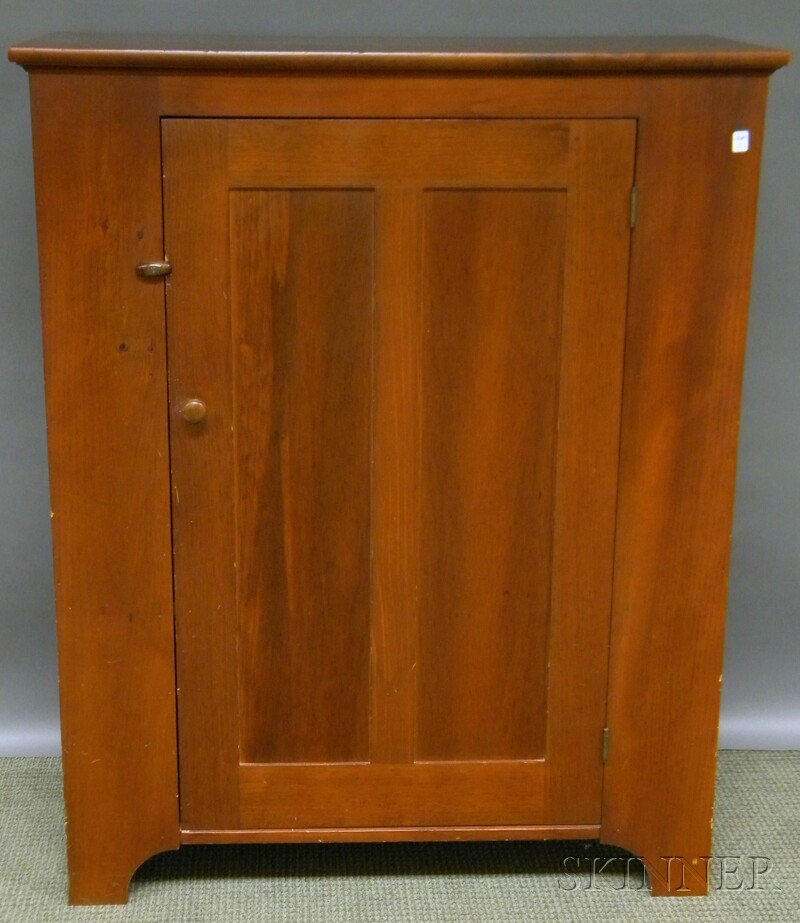 Simms & Thayer Country Stained Pine Cupboard with: Simms & Thayer Country Stained Pine Cupboard with Paneled Door, the interior painted blue with two fixed shelves, branded mark, ht. 48, wd. 39, dp. 18 in.