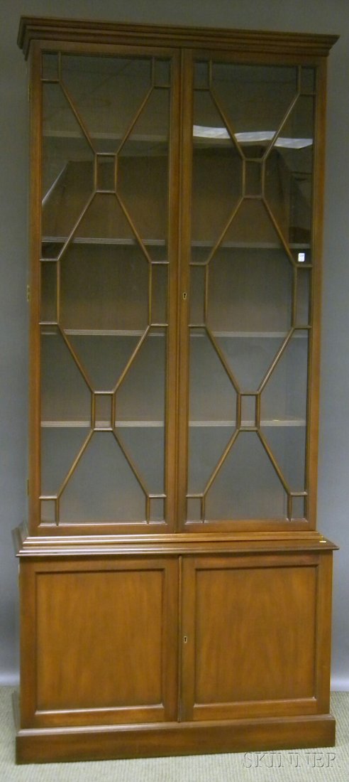 Kittinger Federal-style Glazed Mahogany Step-back: Kittinger Federal-style Glazed Mahogany Step-back Book Cabinet, in two parts, the upper cabinet with two doors and four adjustable interior shelves, the lower cabinet with two paneled doors and adjust