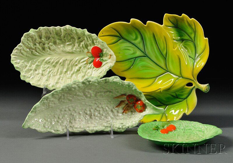 Four Carlton Ware Leaf Dishes, England, 20th centu: Four Carlton Ware Leaf Dishes, England, 20th century, three modeled as lettuce leaves accented by tomatoes: one circular and two oblong; the fourth a tree leaf with three reservoirs, each with backsta