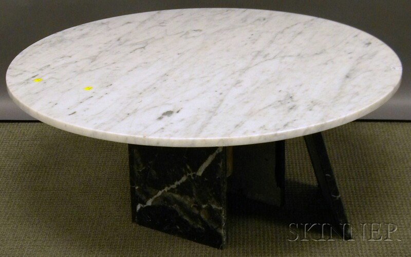 Circular White Marble-top Coffee Table with Black: Circular White Marble-top Coffee Table with Black Marble Pedestal Base, (one base panel detached), approx. ht. 11 1/2, dia. 38 in.