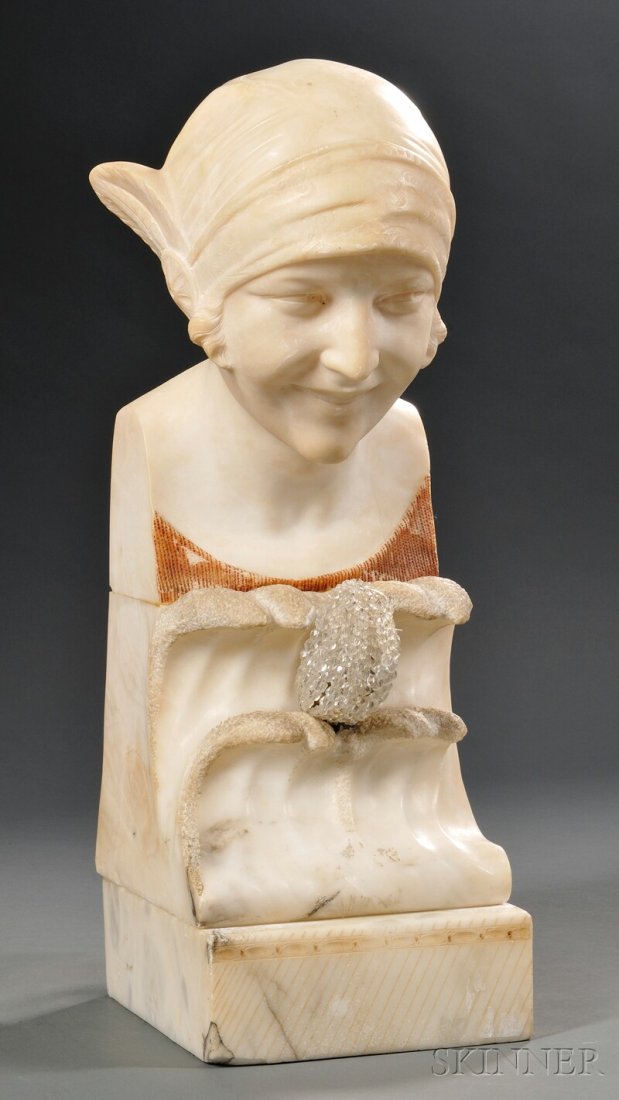 Art Deco Carved Alabaster Illuminated Bust of a Y: Art Deco Carved Alabaster Illuminated Bust of a Young Woman, Continental, c. 1925, the smiling figure wearing a feathered turban and beaded dress, atop a base with wave-like crests and mounted to cent