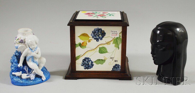 Wood Framed Minton Tile-sided Box with Cover, a E: Wood Framed Minton Tile-sided Box with Cover, a European Porcelain Cherub Figural Vase, and a Black-glazed Pottery Bust of a Woman, the tiles titled "Winter," "Spring," "Summer," and "Autumn," figure 