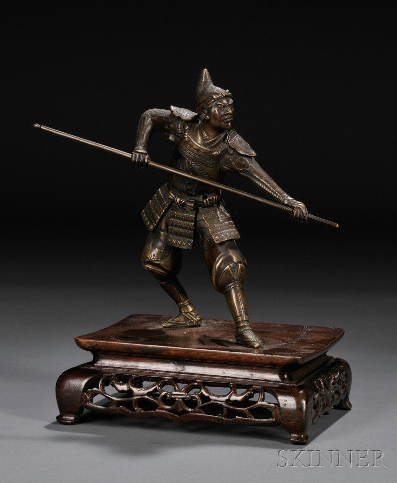 Bronze Figure on Wood Stand, Japan, depicting a war: Bronze Figure on Wood Stand, Japan, depicting a warrior with a fierce expression on his face, dressed in armor and holding a spear in his hands, overall ht. 8 5/8 in.