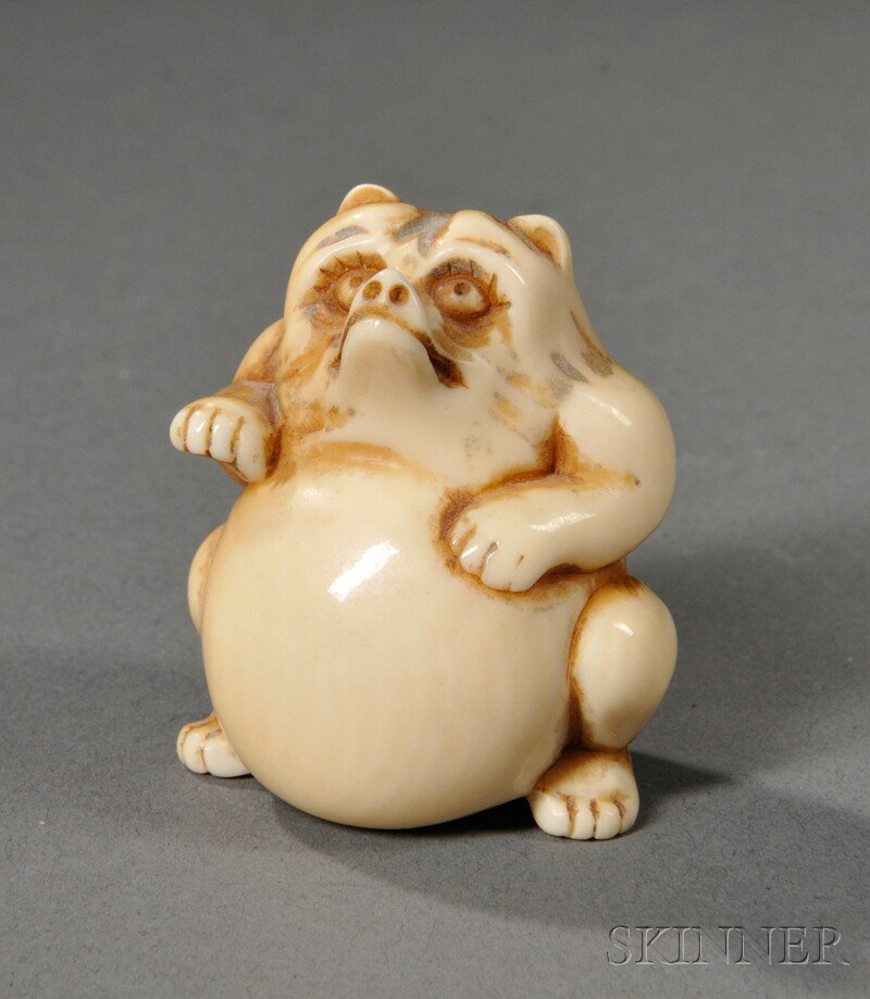 Ivory Netsuke, Japan, depicting a tanooki, signed,: Ivory Netsuke, Japan, depicting a tanooki, signed, ht. 1 3/8 in.