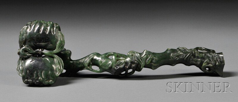 Ruyi Scepter, China, carved with a pair of Buddha: Ruyi Scepter, China, carved with a pair of Buddha hands at the terminal, stone of dark green color, lg. 11 3/4 in.