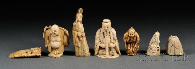 Seven Ivory Carvings, Asia, a Buddha, lg. 2, a sea: Seven Ivory Carvings, Asia, a Buddha, lg. 2, a seated man, lg. 2 1/2, a standing woman lg. 3, a lotus seedpod, lg. 1 1/4, a small mountain with flowers, lg. 1 1/2, an animal, lg. 2, and an old man hol