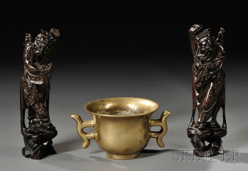Bronze Censer and Pair of Silver-inlaid Wood Carvi: Bronze Censer and Pair of Silver-inlaid Wood Carvings, China, the censer a bulbous body rising to a slightly flaring rim, flanked by kui dragon handles in abstract forms, Xuande mark to the base, dia.