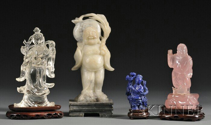 Four Hardstone Carvings, China, a rock crystal car: Four Hardstone Carvings, China, a rock crystal carving of an Immortal, a rose quartz figure of a fisherman, a lapis lazuli standing figure of a goddess, and a soapstone Budai monk on a soapstone stand