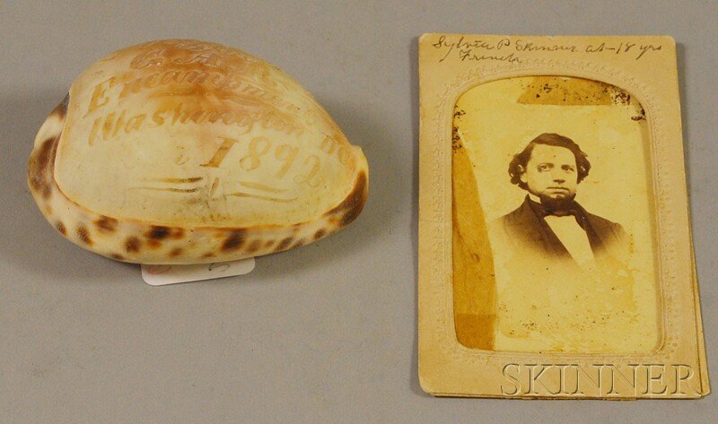 GAR Carved Souvenir Cowrie Seashell and a Carte-d: GAR Carved Souvenir Cowrie Seashell and a Carte-de-visite Portrait Photograph of a Young Man, the shell with carved inscription "Souvenir of the GAR Encampment Washington, D.C. 1892," the photograph f