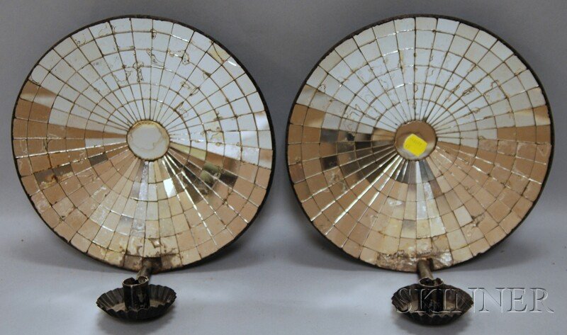 Pair of Mirrored Tin Wall Sconces, round dished re: Pair of Mirrored Tin Wall Sconces, round dished reflectors of radiating geometric mirror segments, black-painted rims, crimped candle cups, and holders, (few cracked segments), ht. 11, dia. 9 1/4 in.
