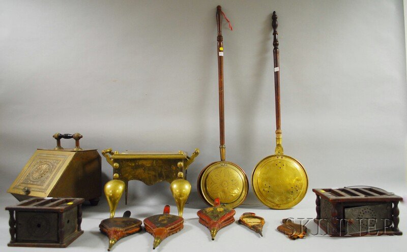 Group of Wood and Metal Hearth and Domestic Items: Group of Wood and Metal Hearth and Domestic Items, four mostly painted and stenciled wood bellows, a brass footman, two punched tin and wood footwarmers, a Victorian pressed brass coal hod, and two br
