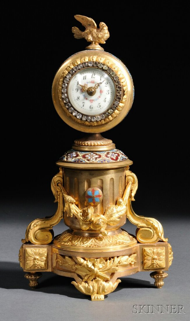 French Gilt-brass and Champleve Desk Clock, France: French Gilt-brass and Champleve Desk Clock, France, c. 1885, floral-decorated Arabic numeral dial with pierced brass hands, paste stones on the hinged brass bezel, classically inspired gilt-brass case