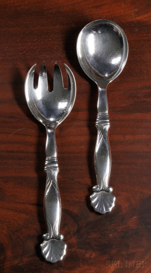 , Georg Jensen Serving Fork and Spoon No. 102, Ster: Georg Jensen Serving Fork and Spoon No. 102 Sterling silver Denmark, Design date 1910 by Georg Jensen Shell form terminus on shaped handle, marked on reverse Georg Jensen, sterling, Denmark, no. 102, 