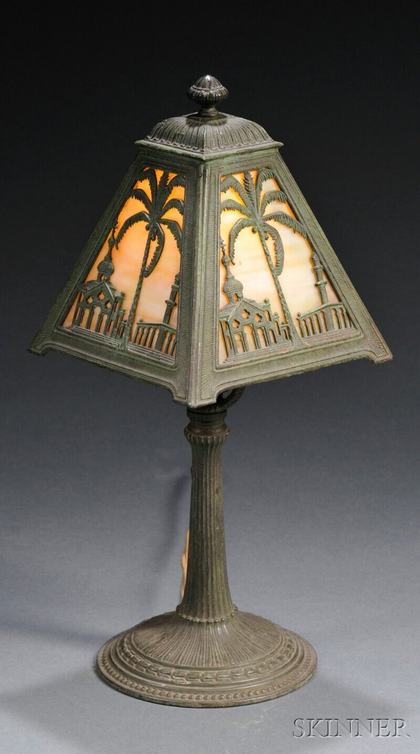 , Small Metal Overlay Lamp, Slag glass and metal,: Small Metal Overlay Lamp Slag glass and metal Pyramid-form shade in caramel slag glass with verdigris metal overlay depicting palm trees and Middle Eastern buildings, ht. 13 1/2 in.