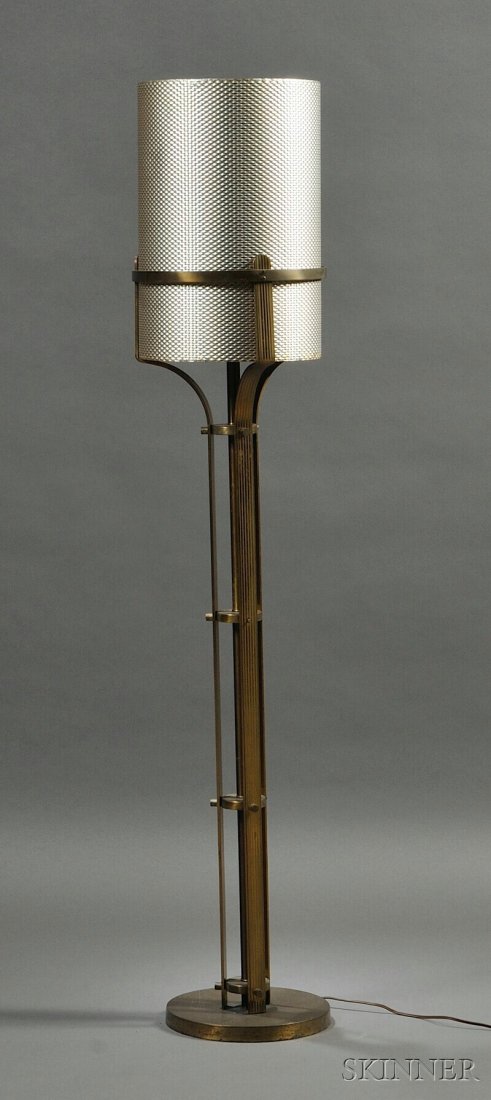 , Art Deco Floor Lamp with Aluminum Shade, , Brass: Art Deco Floor Lamp with Aluminum Shade c. 1940s Brass-plated metal stem rising from a circular base with single light fixture, in an industrial style, supporting the shade constructed from a sheet of
