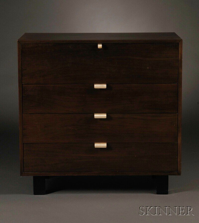 , George Nelson Dresser/Secretary, Walnut, In a da: George Nelson Dresser/Secretary Walnut Herman Miller, mid-20th century In a dark finish, the top compartment with hinged drop-down door on a sliding writing surface opening to interior storage compart