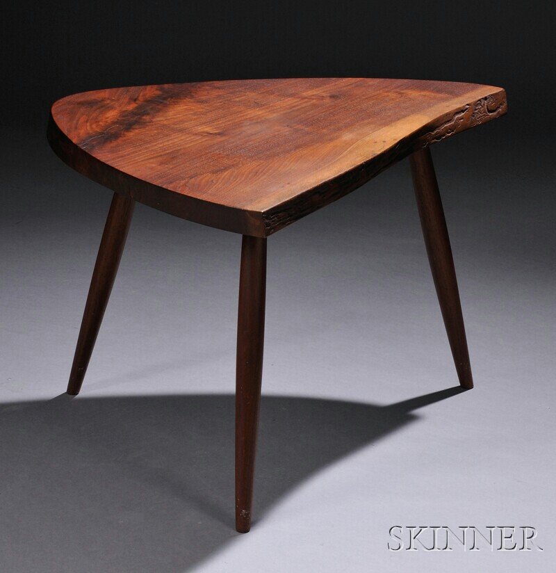 , George Nakashima (1905-1990) Wohls End Table, Wa: George Nakashima (1905-1990) Wohls End Table Walnut New Hope, Pennsylvania, c. 1965 Thick shaped triangular top raised on three tapered legs, marked Howard on base, minor wear, approx. top thickness 1