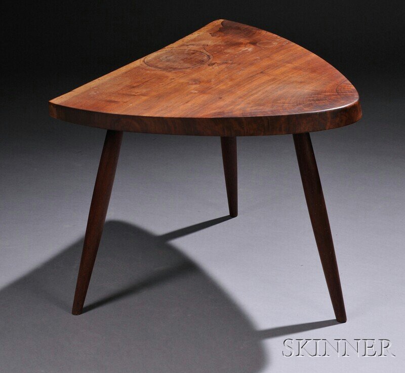 , George Nakashima (1905-1990) Wohls End Table, Wa: George Nakashima (1905-1990) Wohls End Table Walnut New Hope, Pennsylvania, c. 1965 Thick, triangular top on three tapered legs, stains to top, some glue reinforcement where legs join top, approx. top