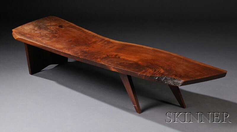 , George Nakashima Coffee Table, Walnut, Freeform: George Nakashima Coffee Table Walnut New Hope, Pennsylvania, c. 1965 Freeform walnut top with natural edge, with butterfly joint over one slab leg and two tapered legs, signed with client's name Howar