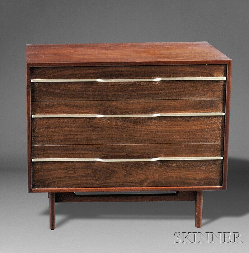 , Jens Risom Chest of Drawers, Walnut and stainles: Jens Risom Chest of Drawers Walnut and stainless steel Mid-20th century Rectangular top over three drawers with stainless steel rods spanning the front and forming handles, on four tapering legs, pape