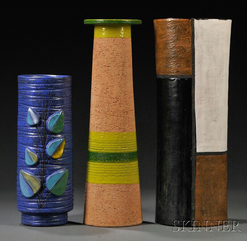 , Three Raymor Pottery Vases, , The first large as: Three Raymor Pottery Vases Italy, mid-20th century The first large asymmetrical cylinder form decorated with geometric blocks in white, black, and brown glazes; the second tall cylindrical form with n