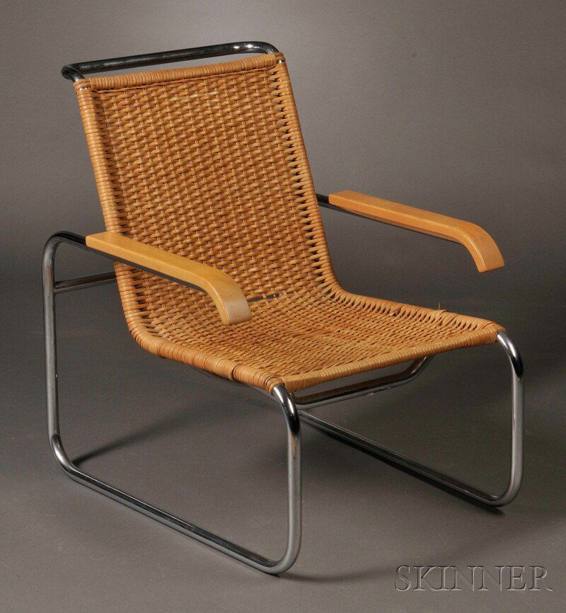 , ICF Lounge Chair, , The curvilinear tubular chro: ICF Lounge Chair Germany, New York, mid-20th century The curvilinear tubular chromed steel frame with shaped birch armrests supporting a caned seat and back, bearing ICF label, some rust breaks to can