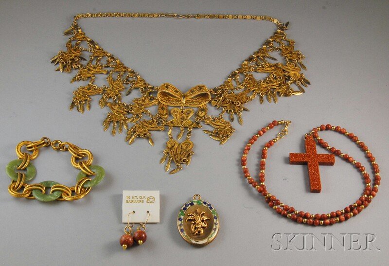Small Group of Assorted Jewelry, a goldstone bead: Small Group of Assorted Jewelry, a goldstone bead necklace with cross pendant and similar earrings, an enamel-decorated locket, a gilt filigree necklace, and a gold-tone metal and green hardstone brac