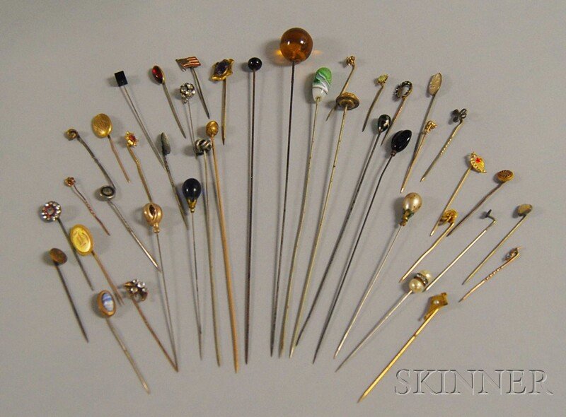 Group of Antique Hat Pins and Stickpins, including: Group of Antique Hat Pins and Stickpins, including gem-set, paste, rhinestone, enamel, abalone, and glass examples.