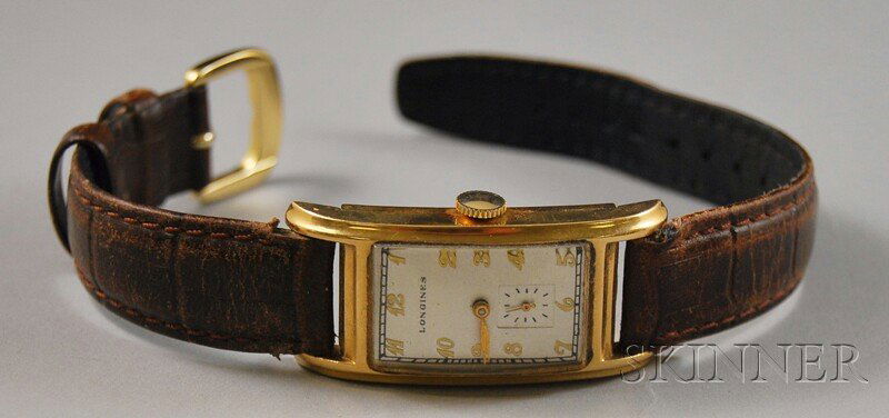 14kt Gold Longines Wristwatch, the rectangular fac: 14kt Gold Longines Wristwatch, the rectangular face with subsidiary seconds dial, case no. 321703, 17-jewel movement no. 6413365, on leather band.