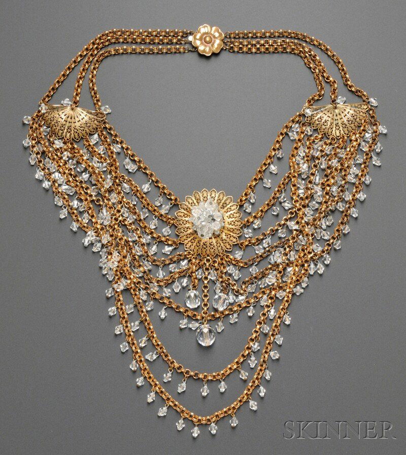 Elaborate Multi-strand Gold-tone and Crystal Cost: Elaborate Multi-strand Gold-tone and Crystal Costume Jewelry Necklace, in the style of Miriam Haskell, unsigned, composed of several overlapping chains punctuated with gold-tone filigree elements and