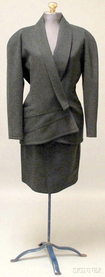 Gianni Versace Gray Wool Tailored Skirt Suit, with: Gianni Versace Gray Wool Tailored Skirt Suit, with shoulder pads, asymmetrical seams, and a cross-over-style collar, marked size 8 and 42.