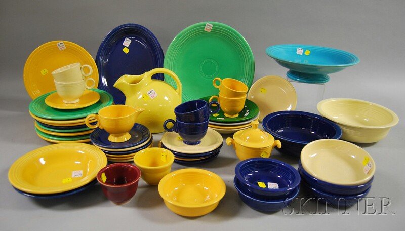 Forty-six Pieces of Homer Laughlin Fiesta Ware, mi: Forty-six Pieces of Homer Laughlin Fiesta Ware, mid-20th century, a footed center bowl, an oval platter, a charger, creamer, sugar, nine dinner plates, six cups and five saucers, six soup bowls, two s