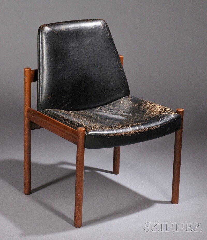 Mid-century Modern Black Leather Upholstered Hard: Mid-century Modern Black Leather Upholstered Hardwood Chair, Dokka Mobler, Norway, black leather seat and back raised on cylindrical legs, (some stress cracks on side and wear), ht. 32, wd. 23 in.