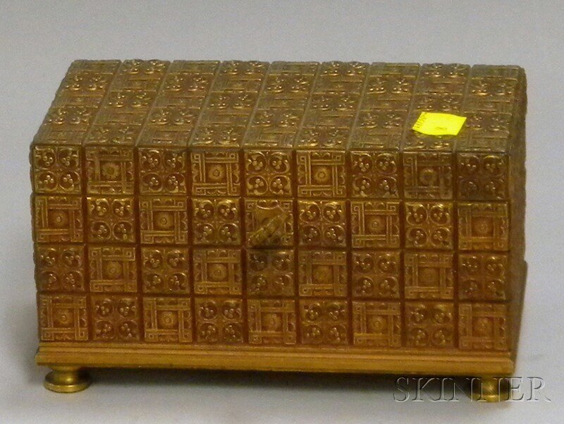 Gilt-bronze Jewel Box, early 20th century, lockin: Gilt-bronze Jewel Box, early 20th century, locking lid with key, interior with remnants of tufted satin lining, unmarked, ht. 3 3/4, lg. 6 3/4, wd. 3 7/8 in.