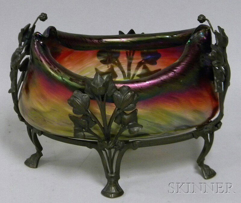 Loetz-type Art Nouveau Iridescent Colored Art Gla: Loetz-type Art Nouveau Iridescent Colored Art Glass Center Bowl in Footed Metal Frame, bowl with polished pontil, approx. ht. 7, lg. 8 1/2 in.