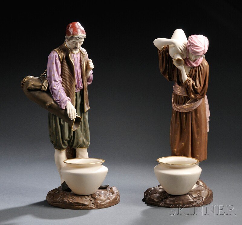 Pair of Royal Worcester Porcelain Eastern Water Car: Pair of Royal Worcester Porcelain Eastern Water Carriers, England, c. 1881, each gilded, bronzed, and enamel decorated to an ivory ground, impressed and printed marks, ht. 16 1/2, 17 1/2 in.