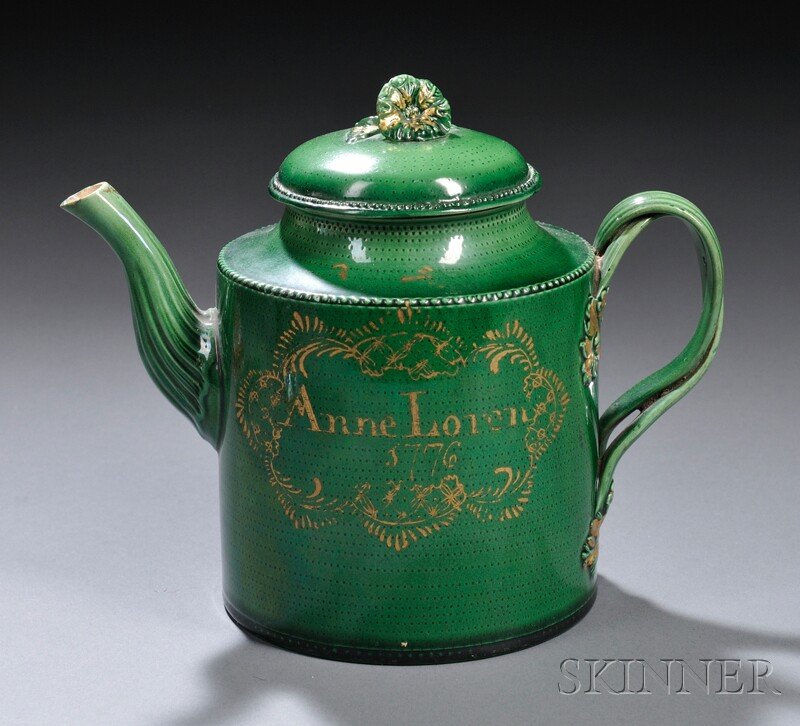 Yorkshire Green-glazed Creamware Teapot and Cover,: Yorkshire Green-glazed Creamware Teapot and Cover, possibly Leeds, dated 1776, cylindrical with domed lid topped by a flower finial, over concave neck, ribbed double-intertwined loop handles with foli