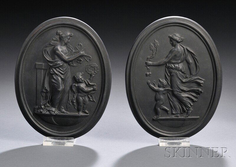Pair of Wedgwood Black Basalt Self-framed Plaques,: Pair of Wedgwood Black Basalt Self-framed Plaques, England, 19th century, each oval with a relief depiction, one Night, the other Day, impressed marks, 5 x 6 1/2 in.