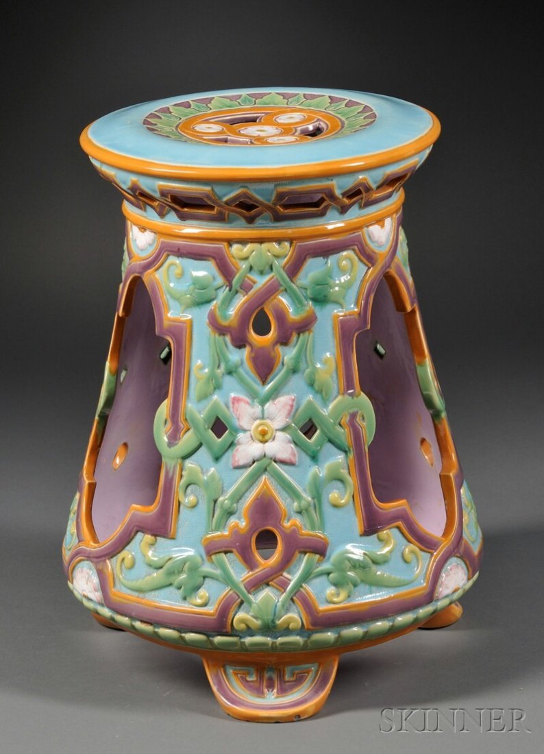 Minton Majolica Garden Seat, England, c. 1869, the: Minton Majolica Garden Seat, England, c. 1869, the waisted circular form decorated with pierced geometric patterns, and abstract floral and strapwork motifs on a turquoise ground, all on three rounded