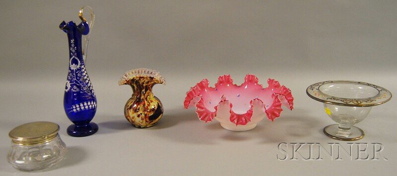 Five Assorted Glass Items, three pieces of late Vic: Five Assorted Glass Items, three pieces of late Victorian art glass, an End-of-Day vase, cased ruffled rim bowl, and an enamel floral-decorated cobalt glass ewer with applied colorless glass handle, a