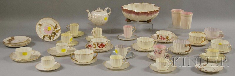 Lot of Ott & Brewer Porcelain Tableware, including: Lot of Ott & Brewer Porcelain Tableware, including twenty-five saucers, seventeen cups, a pair of beakers, a teapot, and a lotus blossom-form footed bowl, and matching cups and saucers, red stamp mark