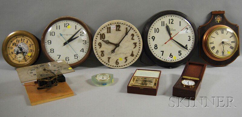 Nine Clocks, two 12-in. dial electric wall clocks;: Nine Clocks, two 12-in. dial electric wall clocks; a quartz movement mounted in an iron case with a 10-in. brass screw-on bezel; a "Trans-Clock" in original case; two slave clocks, one in a metal case