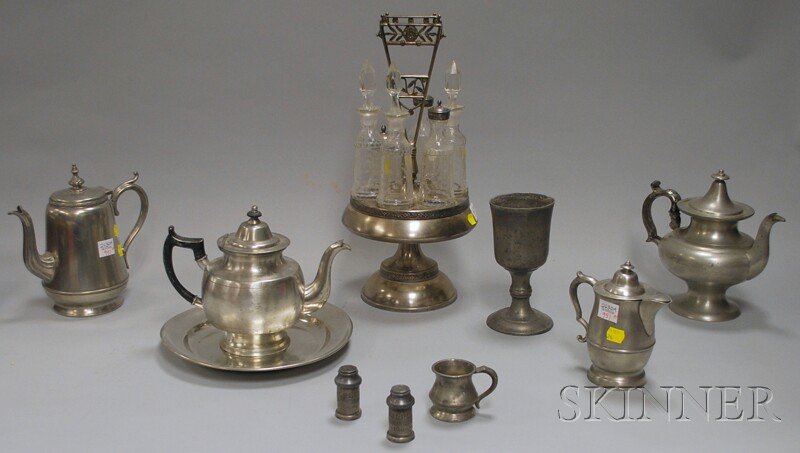 Nine Pewter Table Items and a Silver Plate and Cut: Nine Pewter Table Items and a Silver Plate and Cut Glass Caster Set, pewter: a teapot by Rufus Dunham, (Westport, Maine), a 10 in. Reed & Barton plate, a teapot by Isaac C. Lewis, (Meriden, Connecticu