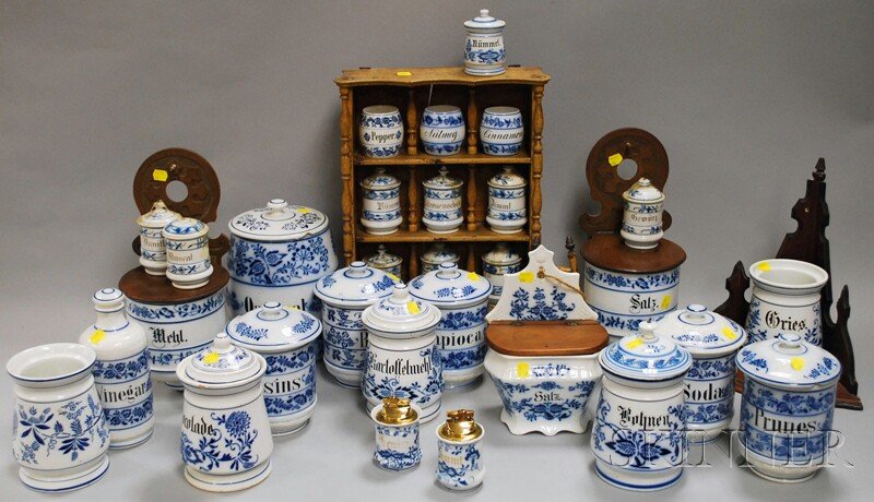 Group of Blue and White-decorated Kitchen Ware and: Group of Blue and White-decorated Kitchen Ware and Accoutrements, mostly ceramic food storage canisters, also including a bottle and two lighters, two wall-mounted canisters, a wooden corner shelf, a 