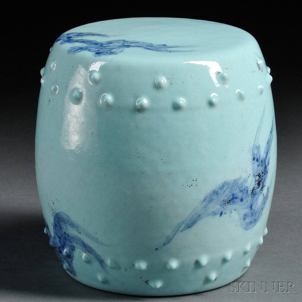 Porcelain Miniature Garden Seat, China, 19th/20th c: Porcelain Miniature Garden Seat, China, 19th/20th century, drum shape, decorated with light blue glaze and dark blue decorations of abstract flames, with two holes drilled on one side, gilt six-charac